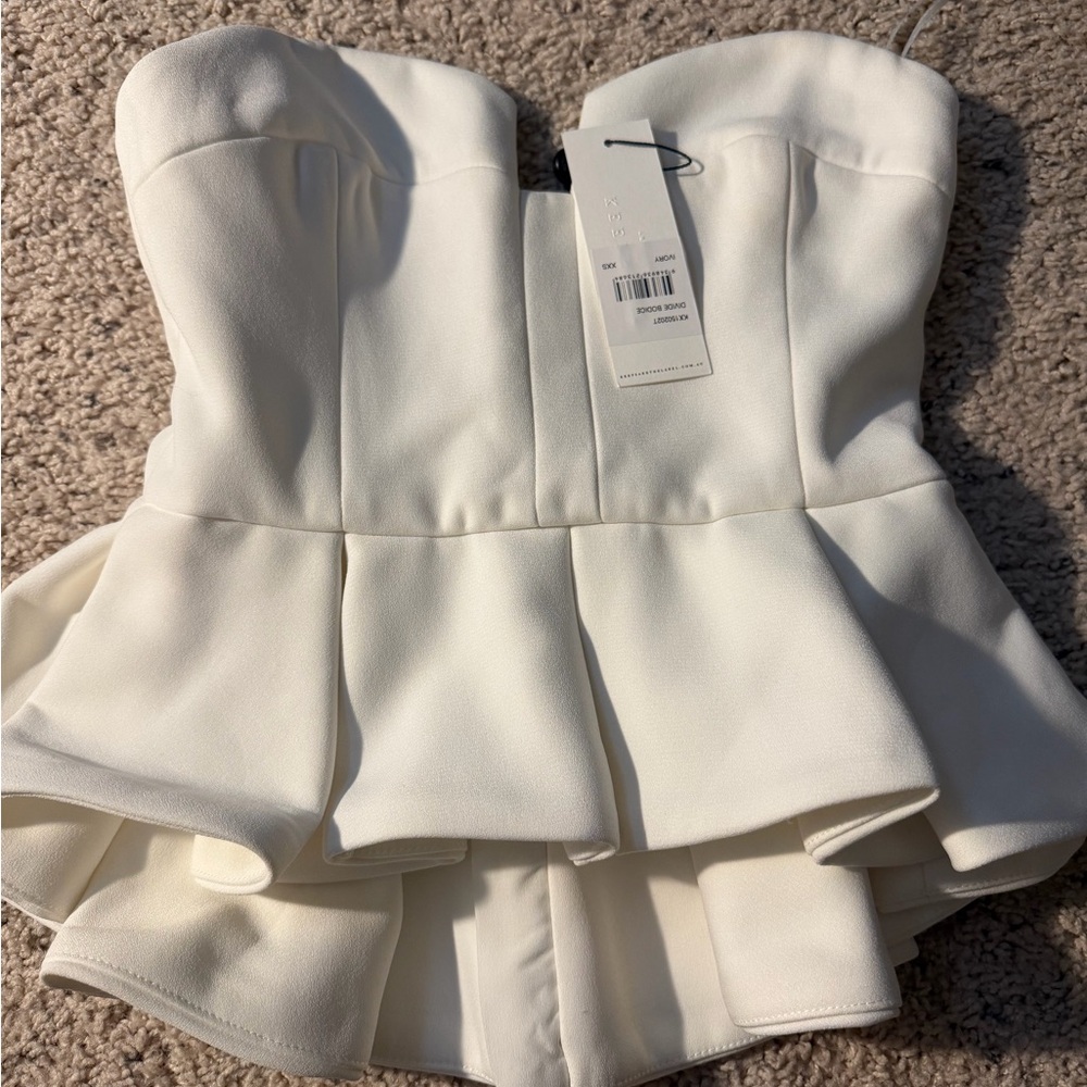 Elegant White Strapless Peplum Top keepsake